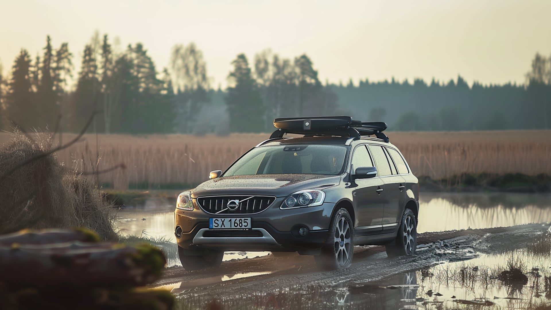 Volvo XC70 suv on a muddy road.