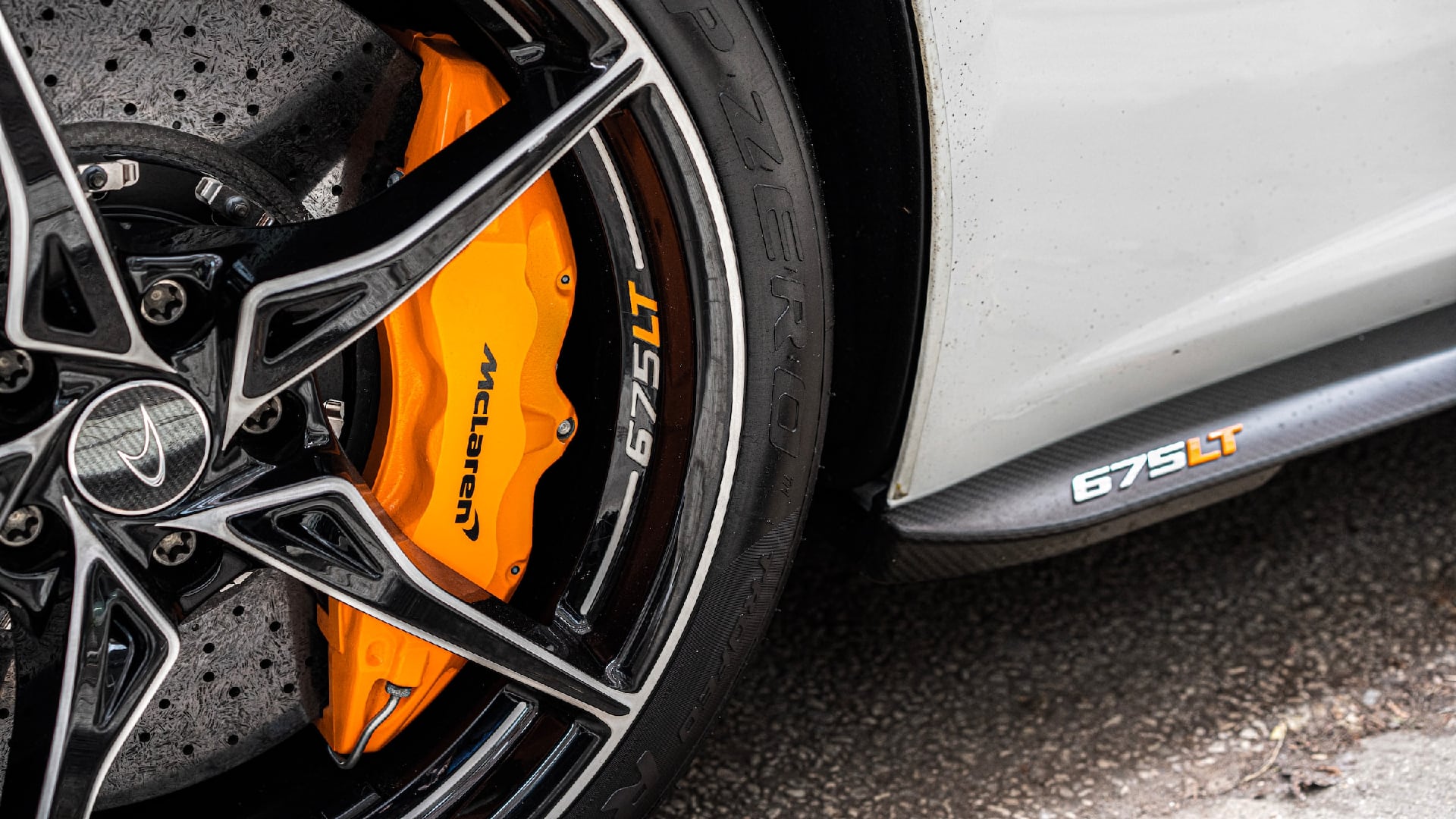 a close up of a sports car tire.