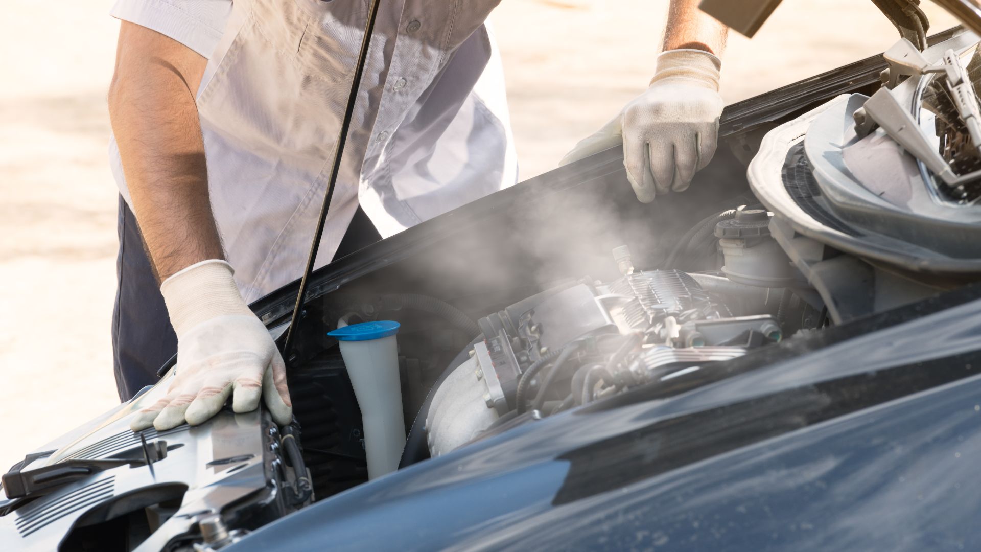 a man in white gloves working on a car engine.|a person holding two gauges in front of a car.|a close up of a propane bottle with a hose connected to it.