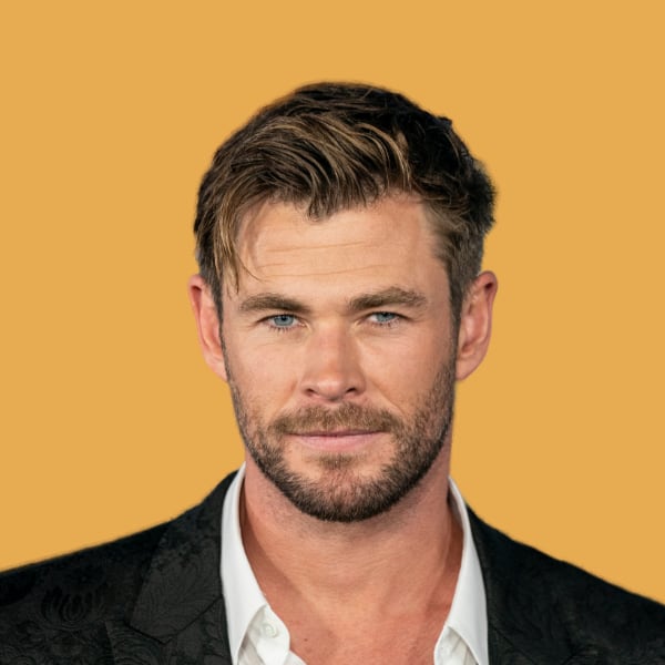 a close up of a person wearing a suit.