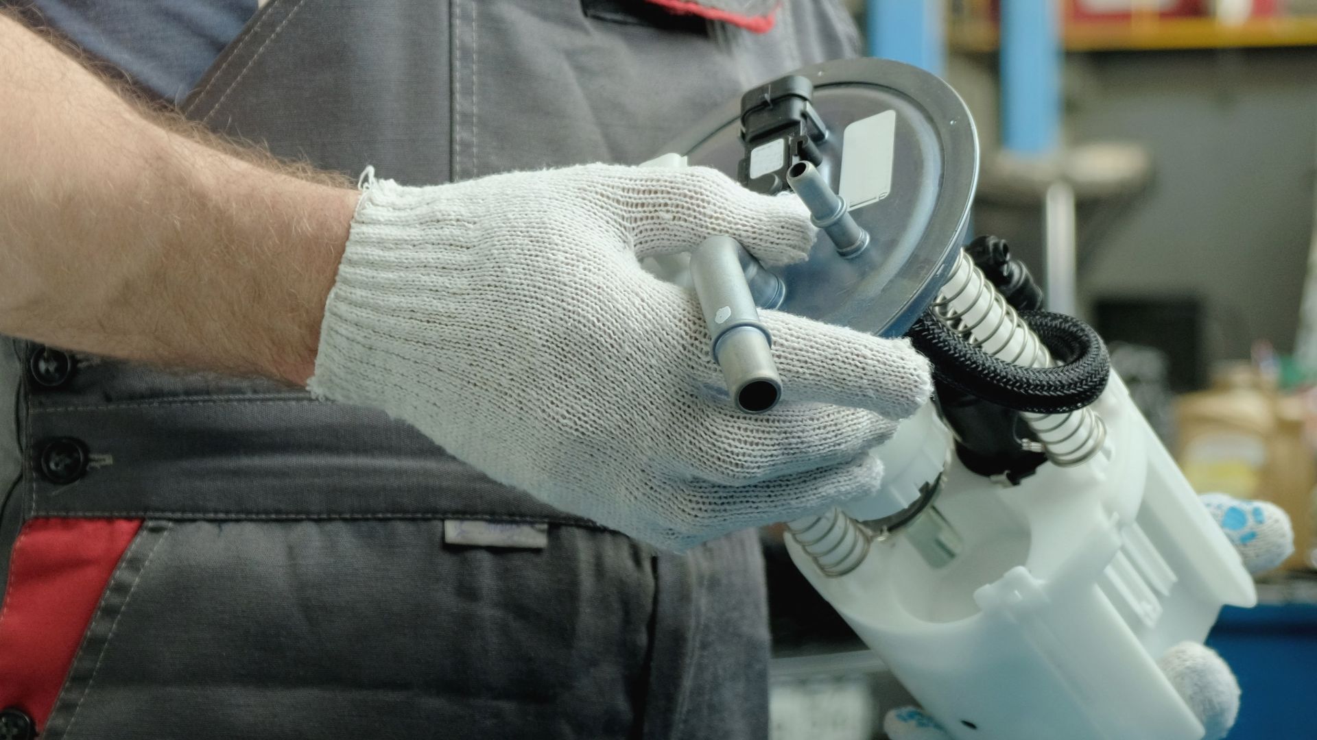 a man is holding a sprayer in his hand.