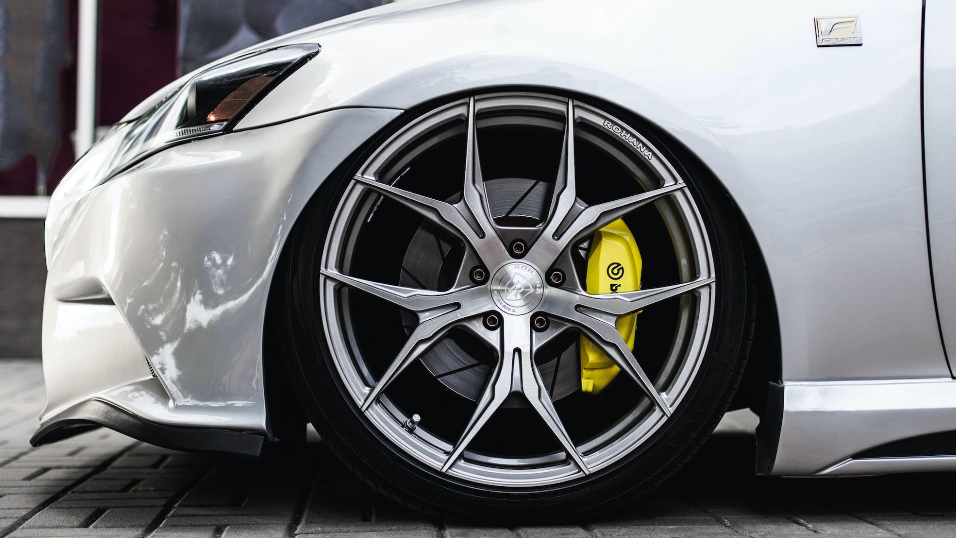 a close up of a car tire on a street.