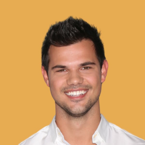 a man with a goatee and a white shirt.