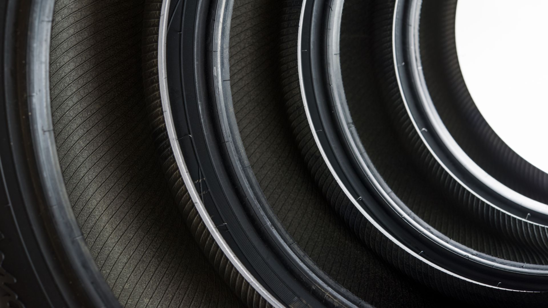 a close up of a tire on a white background.