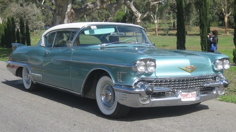 a classic car parked on the side of the road.