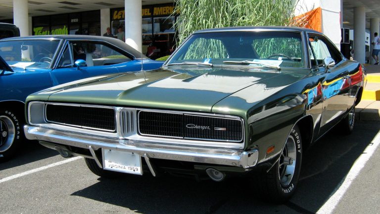 a car parked in a parking lot next to another car.