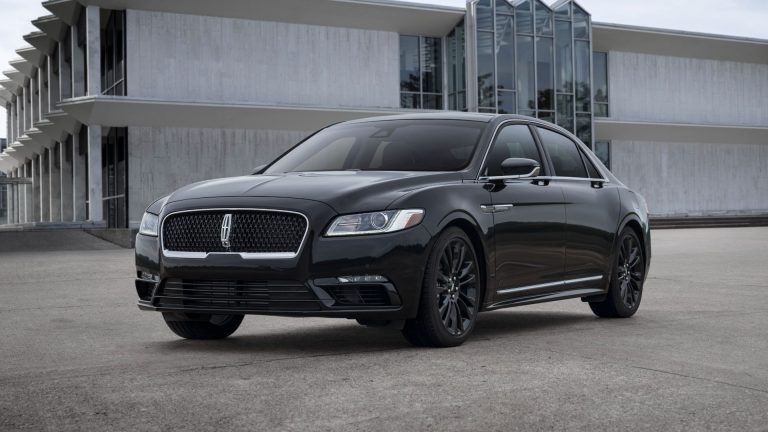 a black car parked in front of a building.