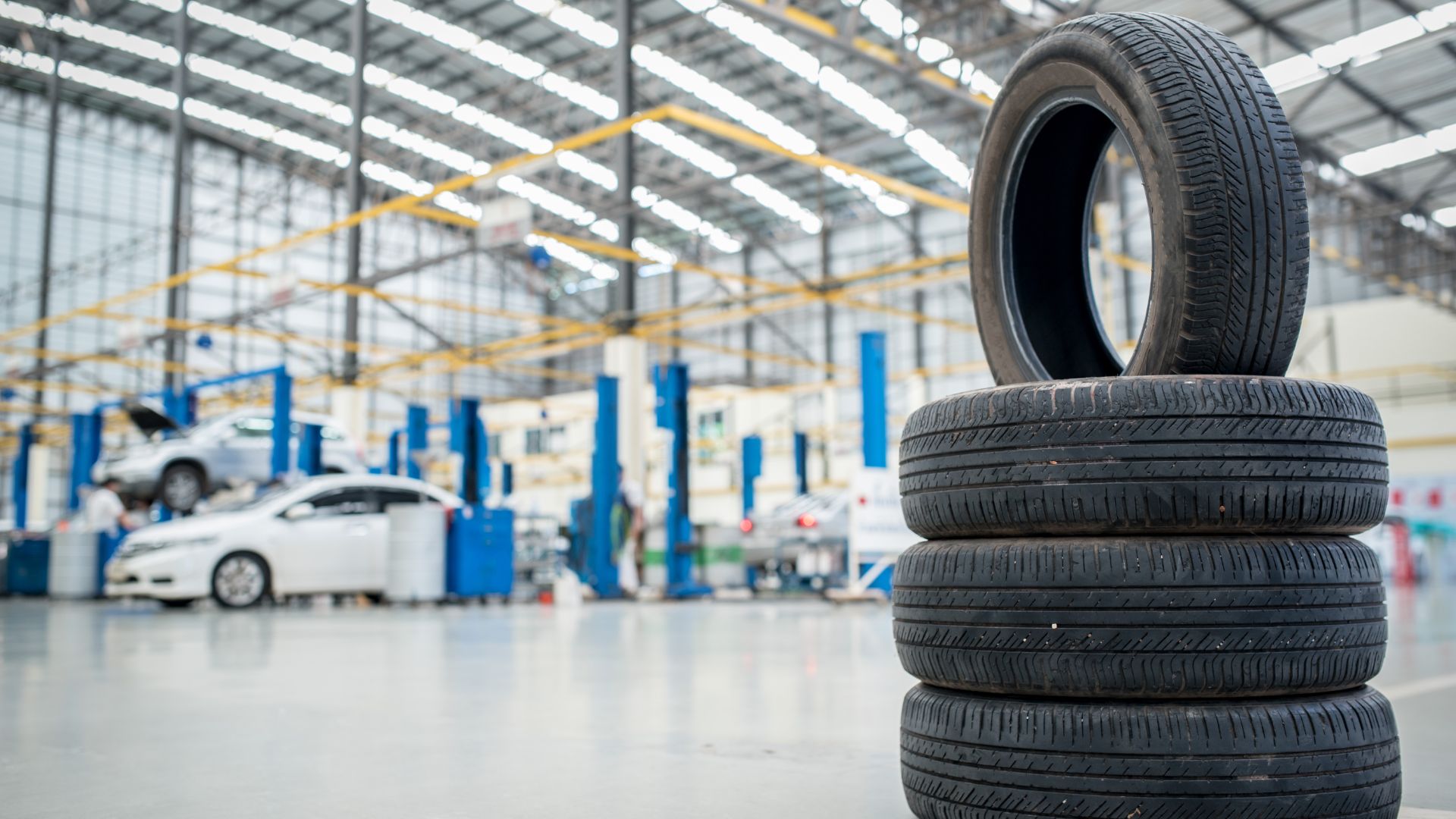 two tires stacked on top of each other in a warehouse.