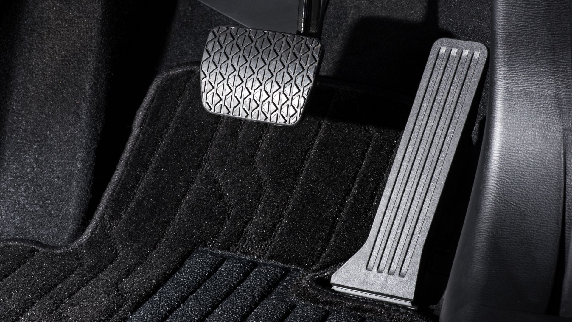 a close up of a car floor with a pedal.