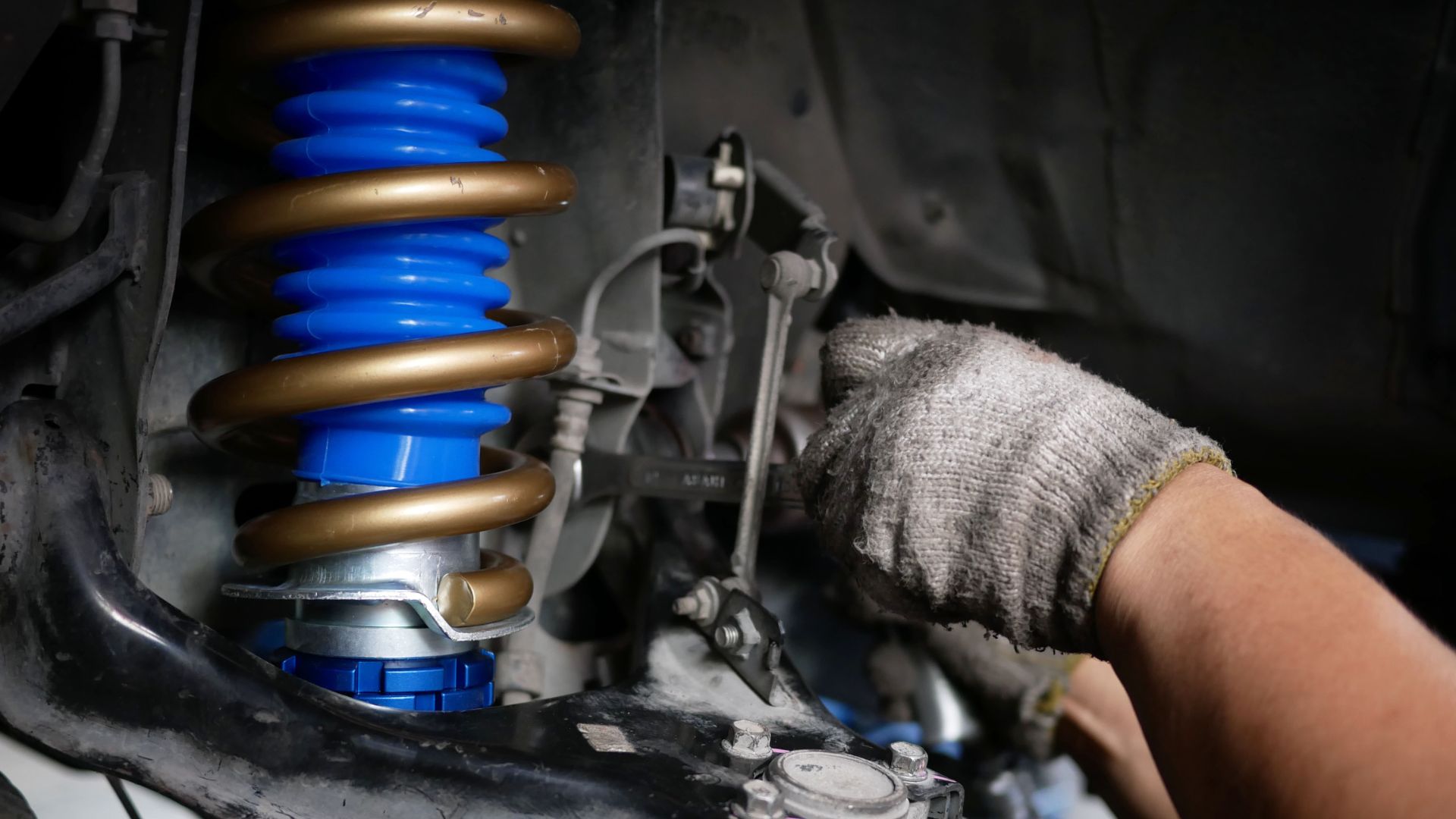 a close up of a person working on a vehicle.