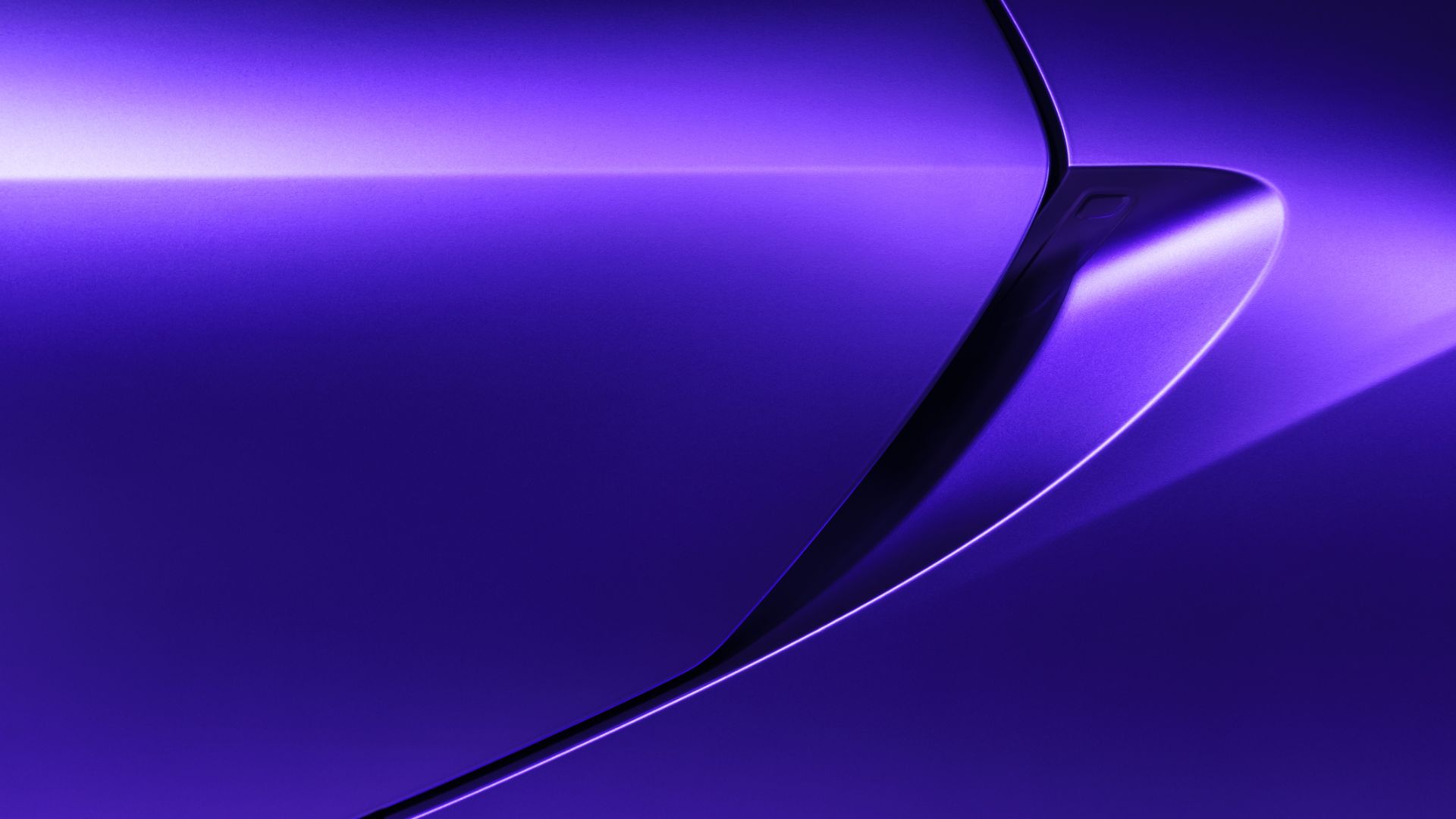 a close up view of a shiny purple surface.