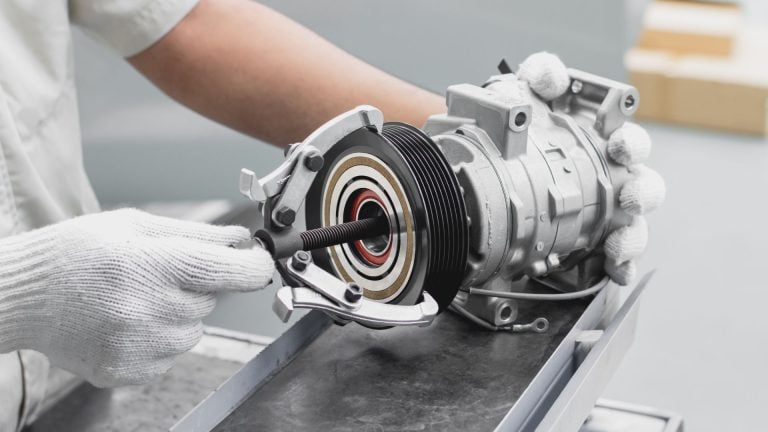 a close up of a person working on a machine.