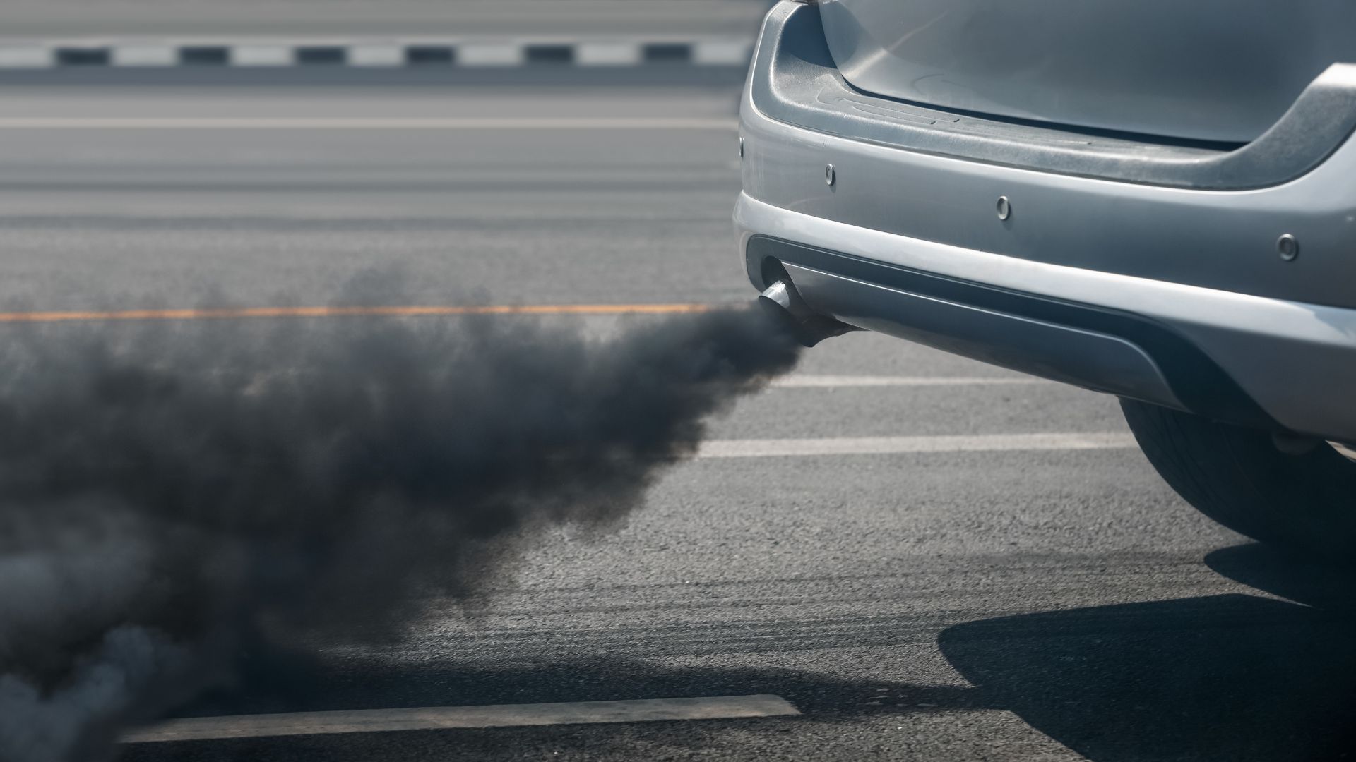 a car with a lot of black smoke coming out of it.