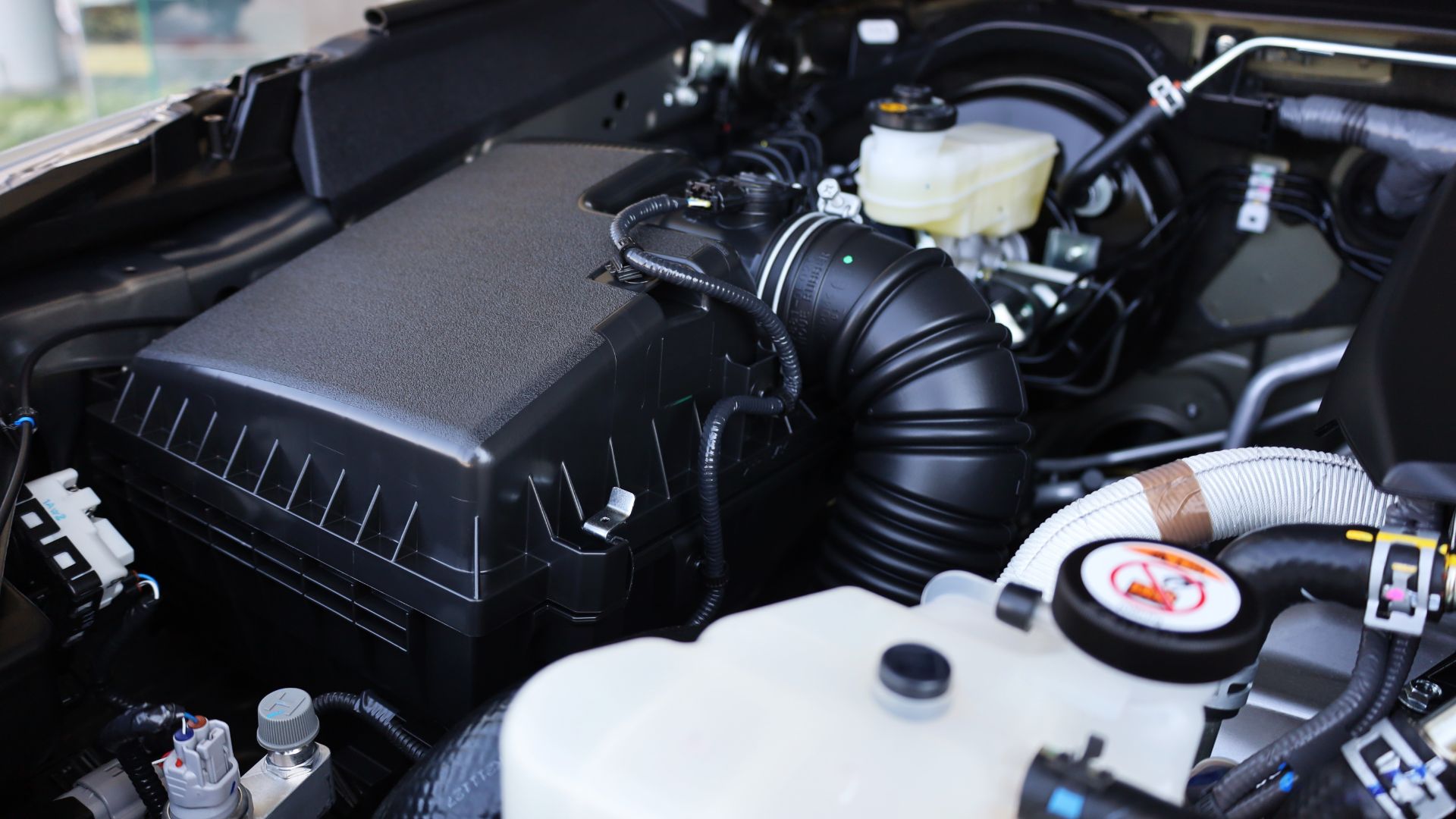 the engine compartment of a car with its hood open.