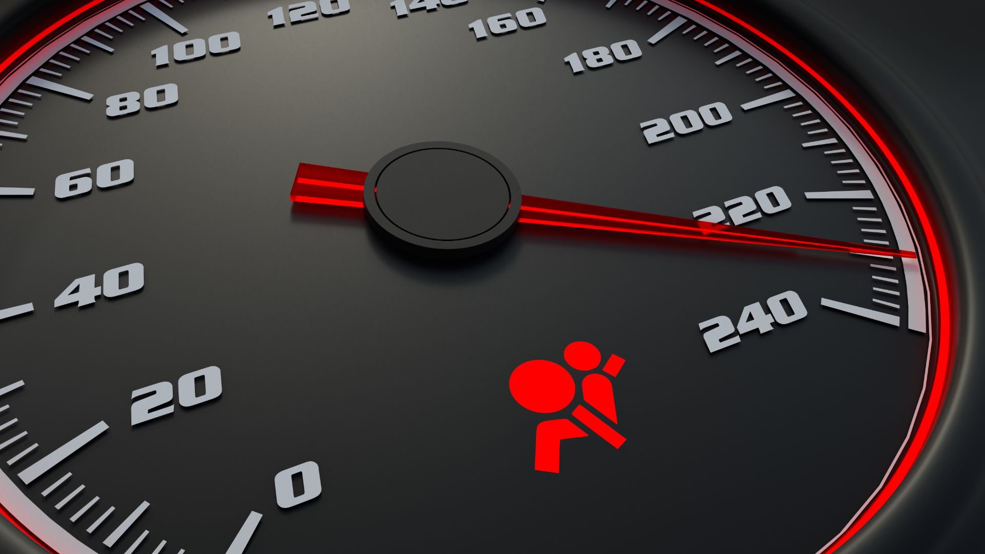 a close up of a speedometer with a red light.
