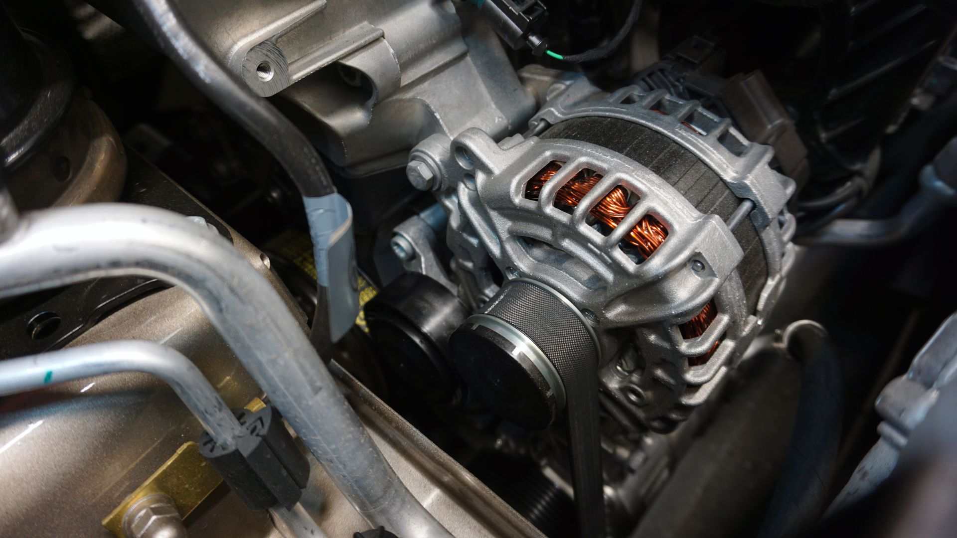 a close up of a motorcycle engine with a red light.