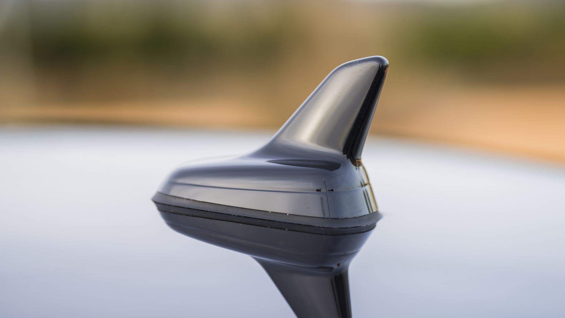 a close up of a car mirror with a blurry background.