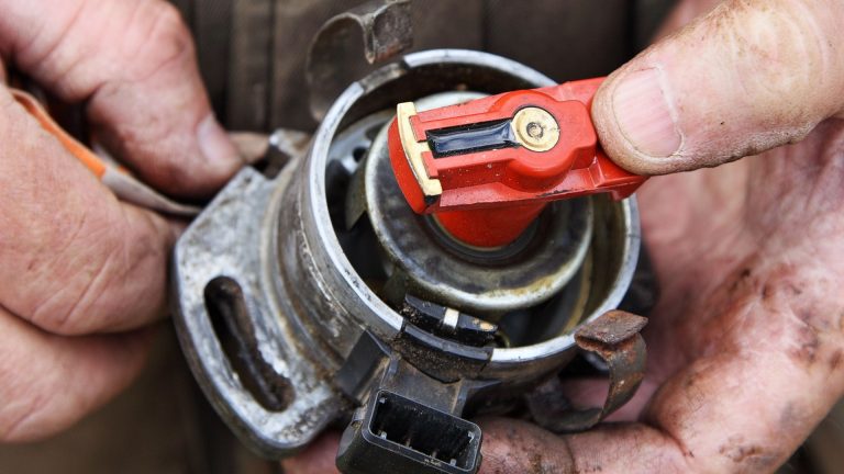 a close up of a person holding a wrench.