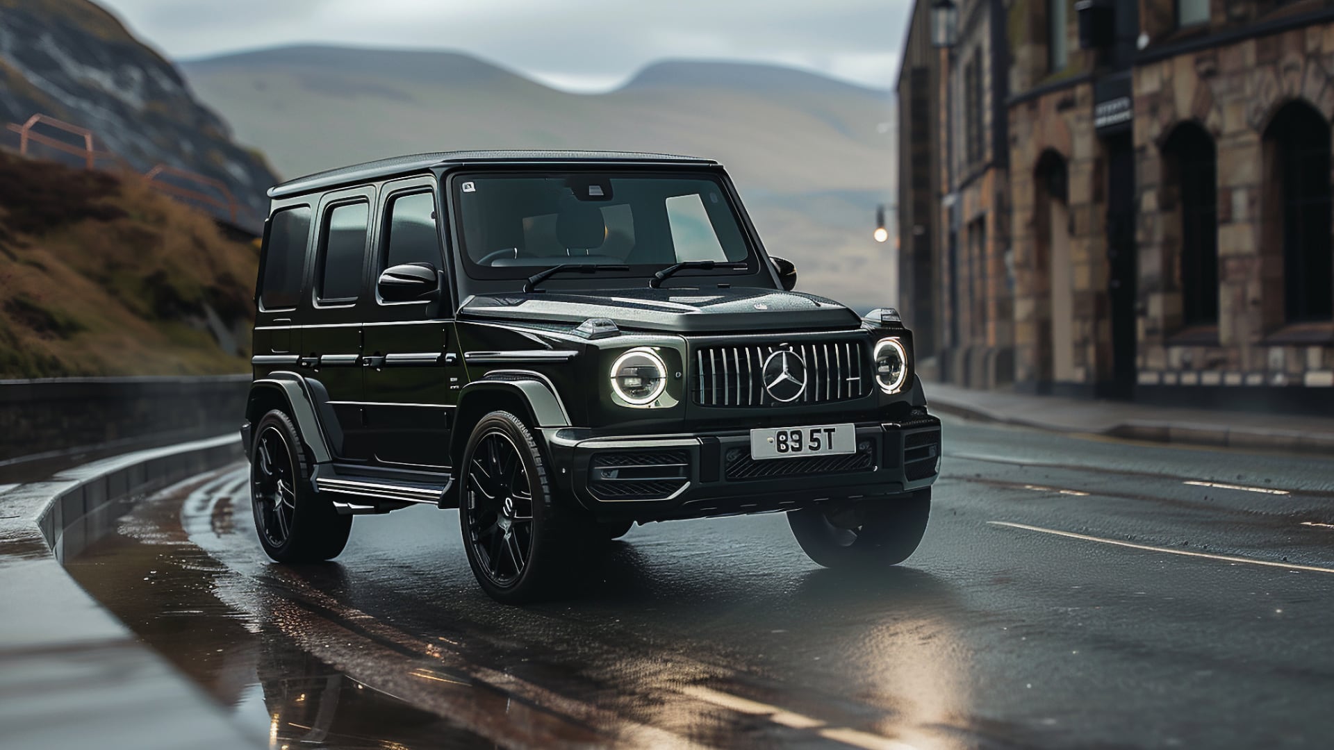 The Mercedes G Wagon is driving down a wet road.