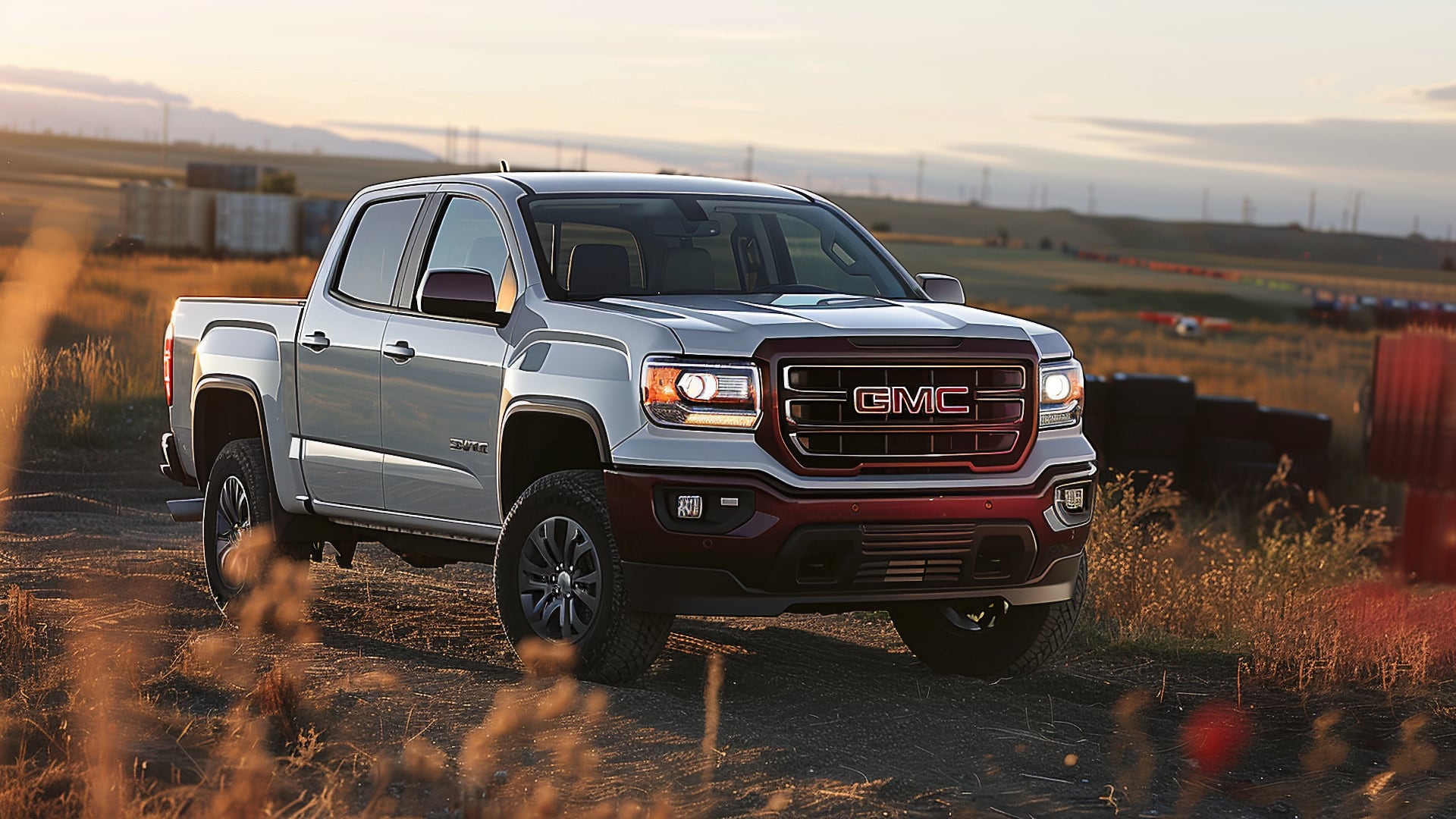 The 2019 GMC Canyon is driving down a dirt road.