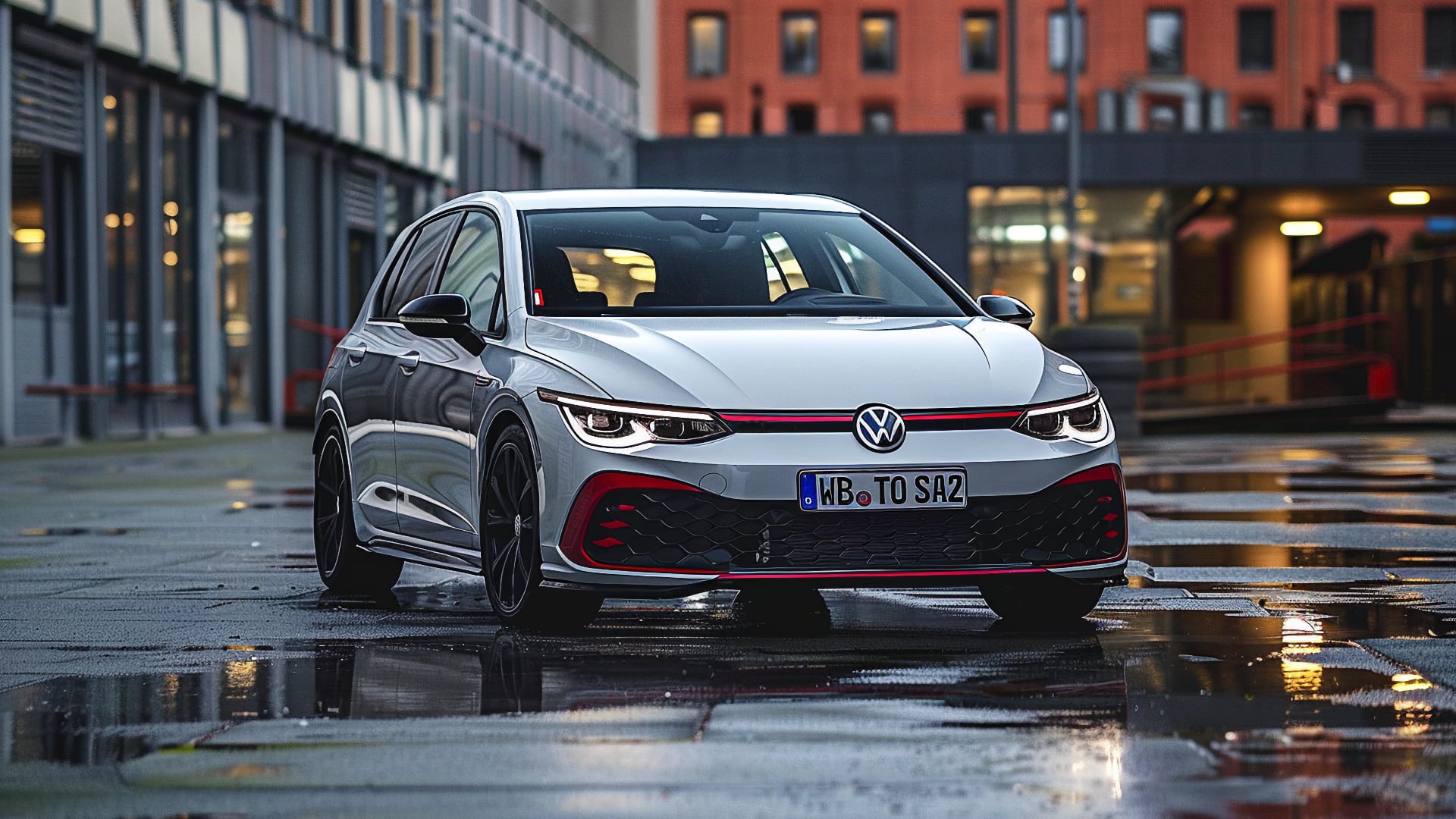 The 2019 Volkswagen Golf GTI, a model year to avoid, is parked on a wet street.