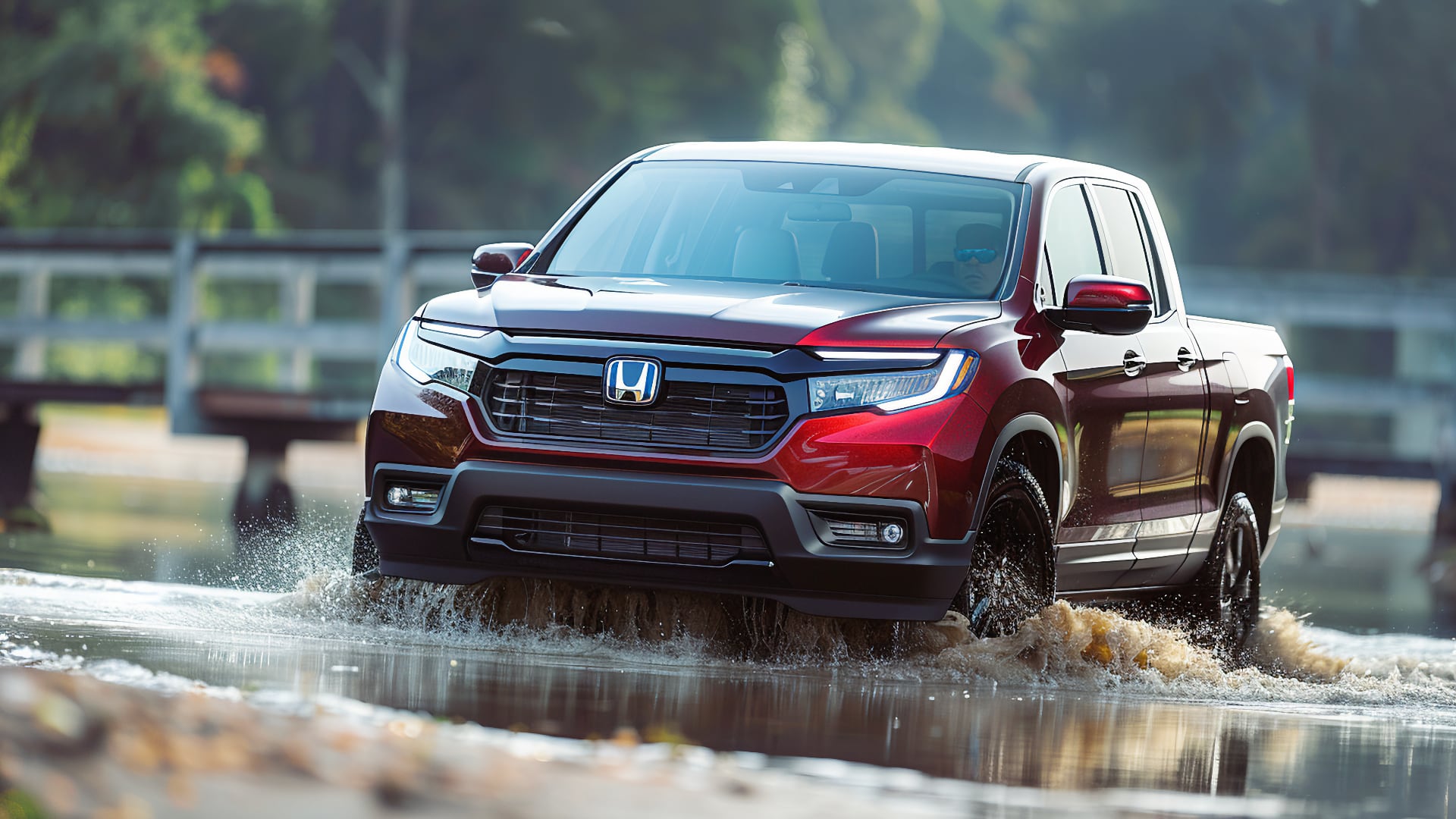 The red 2019 Honda Ridgeline is cautiously driving through water.