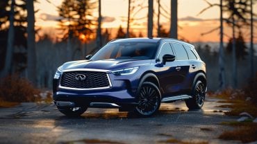 The 2020 Infiniti QX60 SUV is parked on a road in the woods.