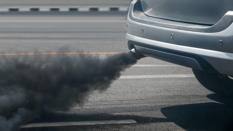 a car with a lot of black smoke coming out of it.