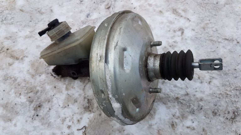 a close up of a metal object on a snow covered ground.