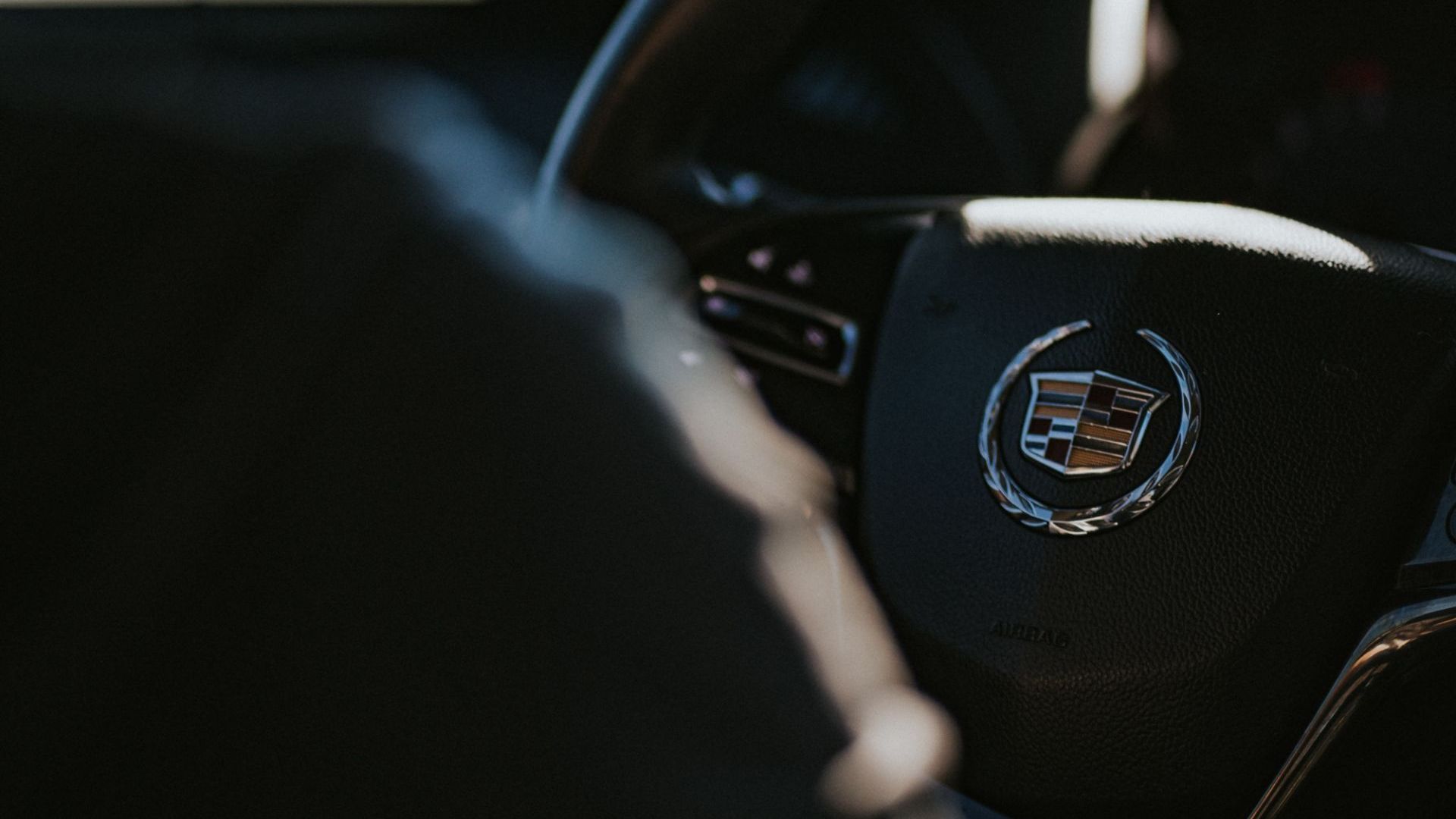 a close up of the steering wheel of a car.