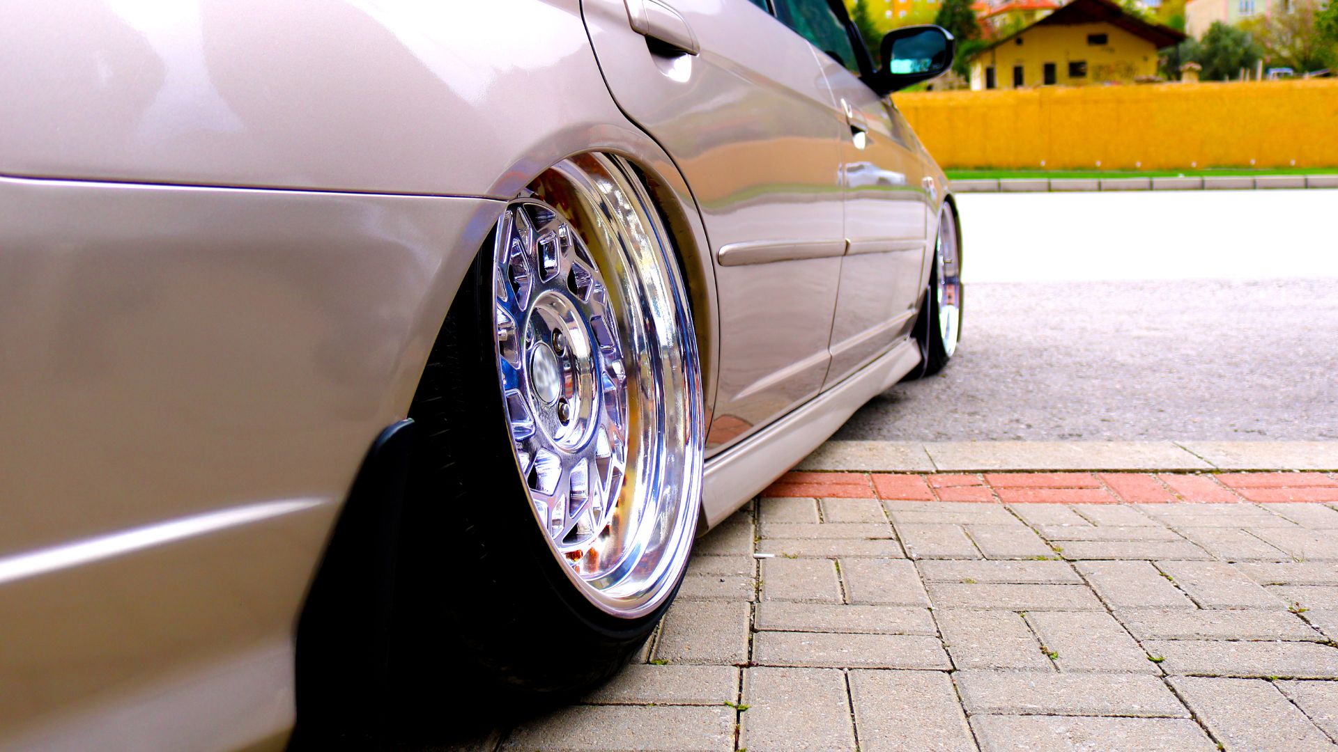 a close up of a car parked on the side of the road.