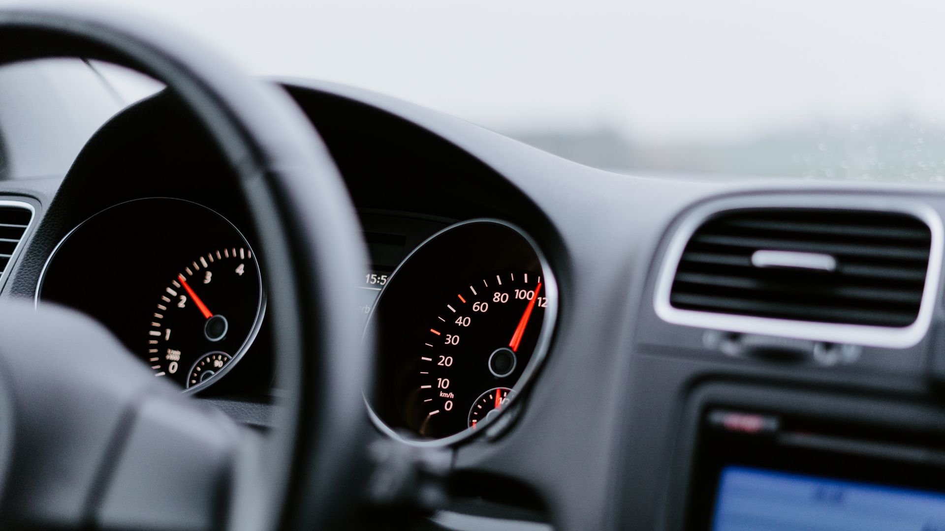 the dashboard of a car with a speedometer.