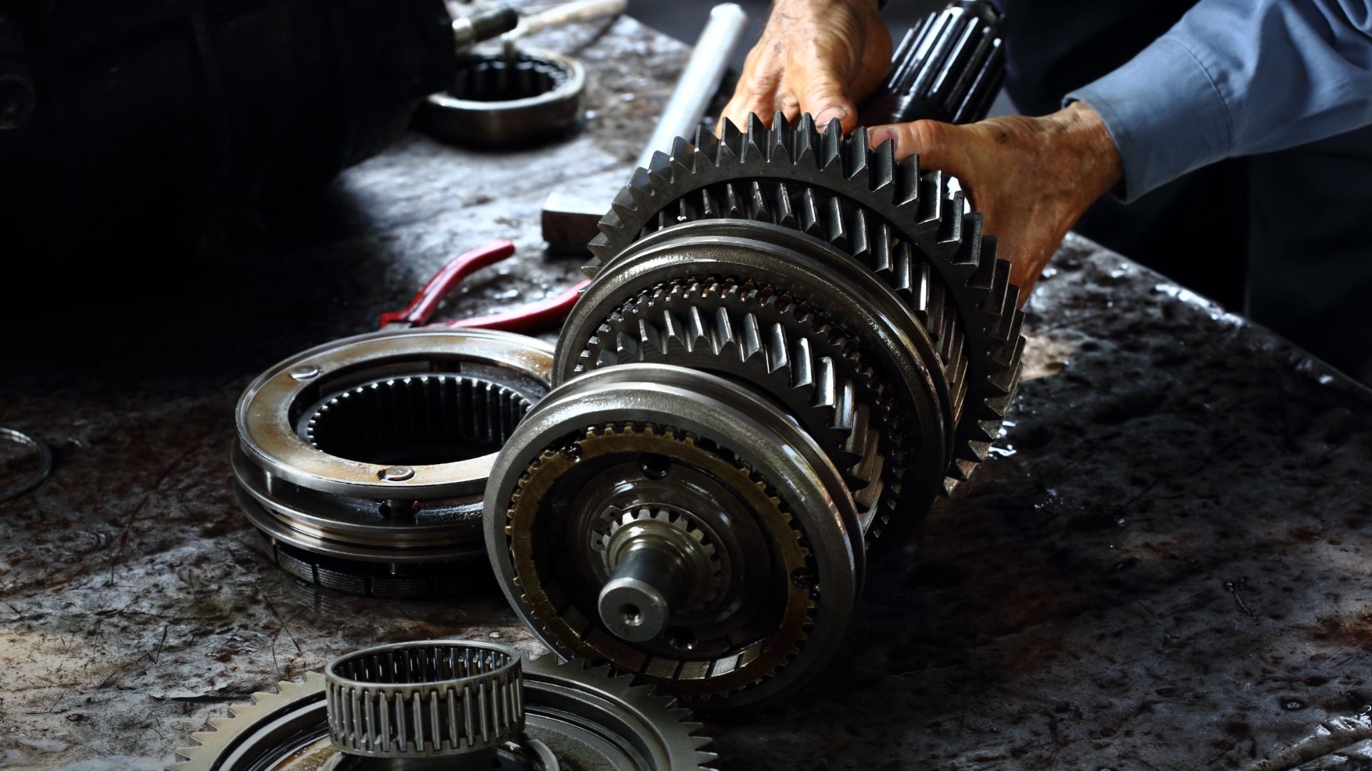 a close up of a person working on a machine.