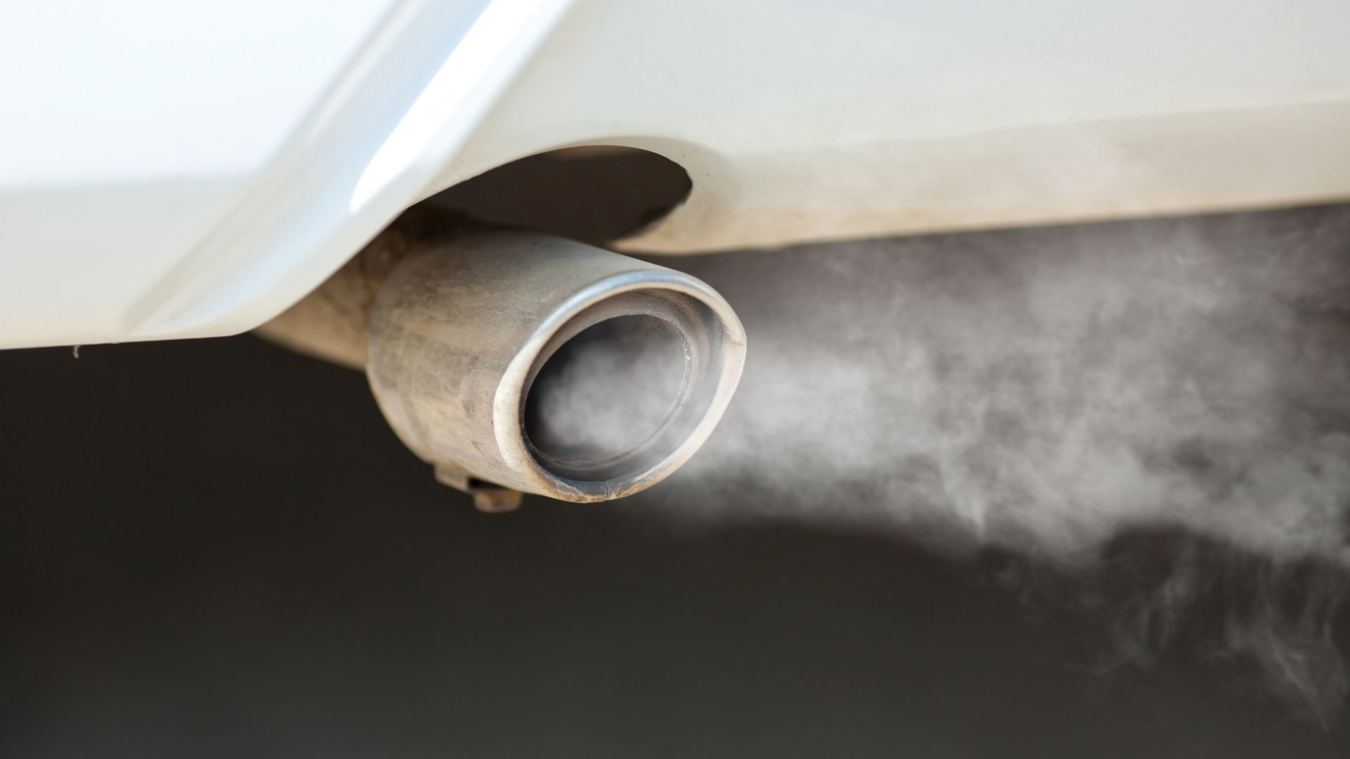 a close up of a exhaust pipe on a car.
