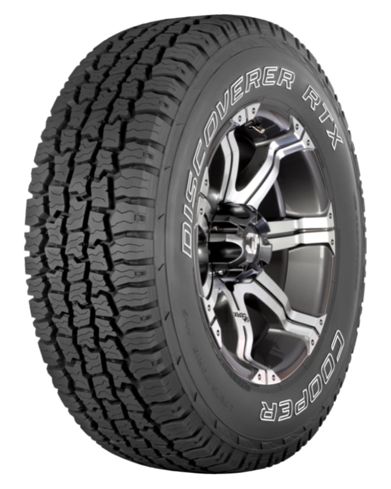 an all terrain tire on a white background.