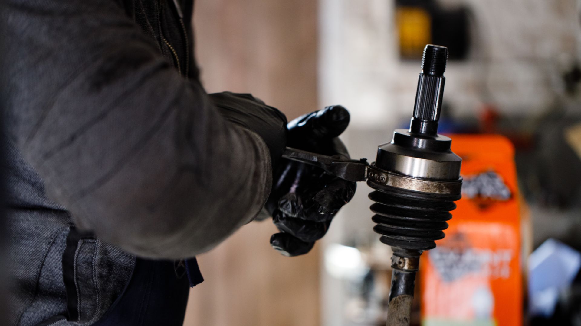 a close up of a person working on a vehicle.