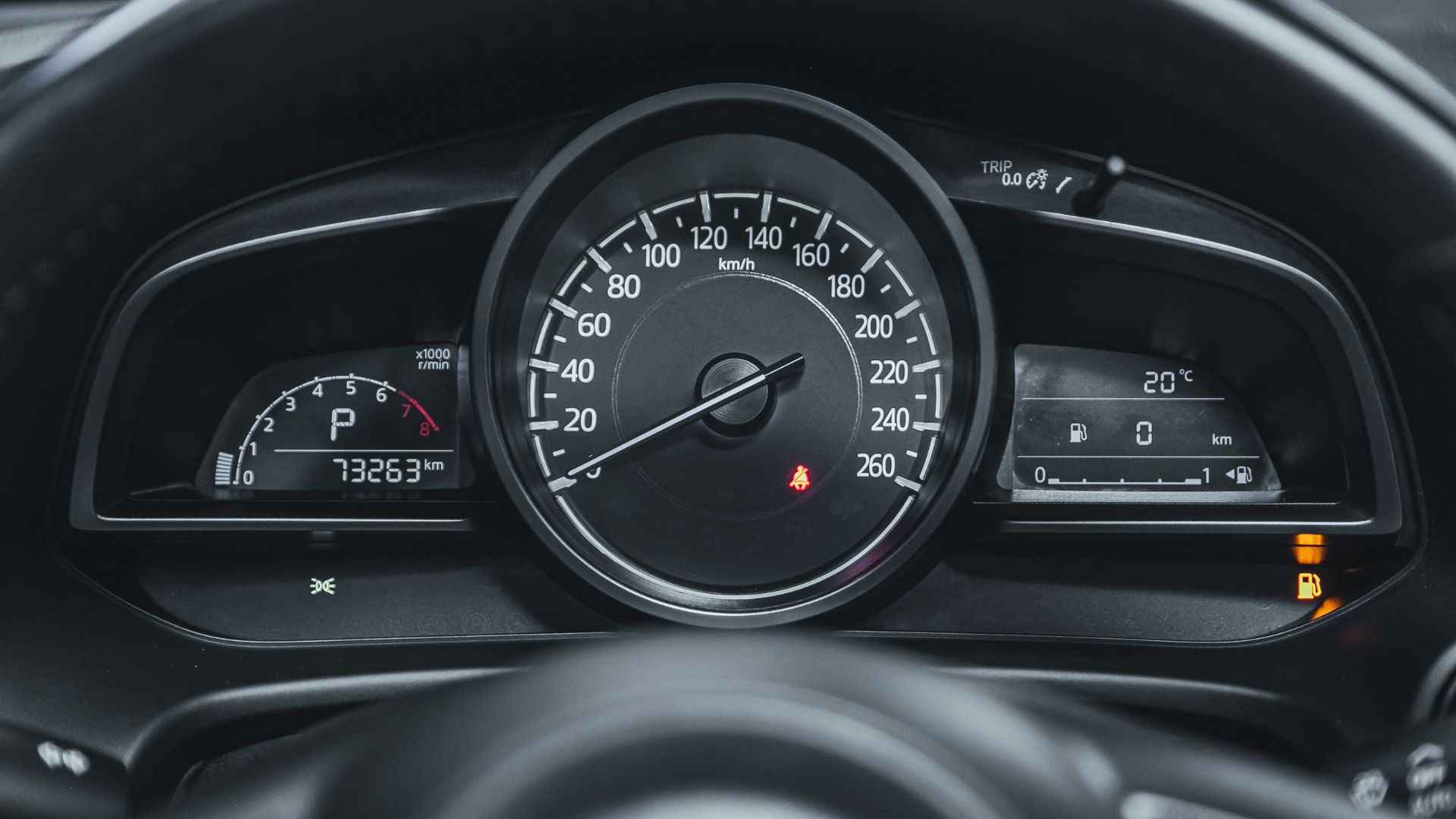 a close up of a speedometer in a car.