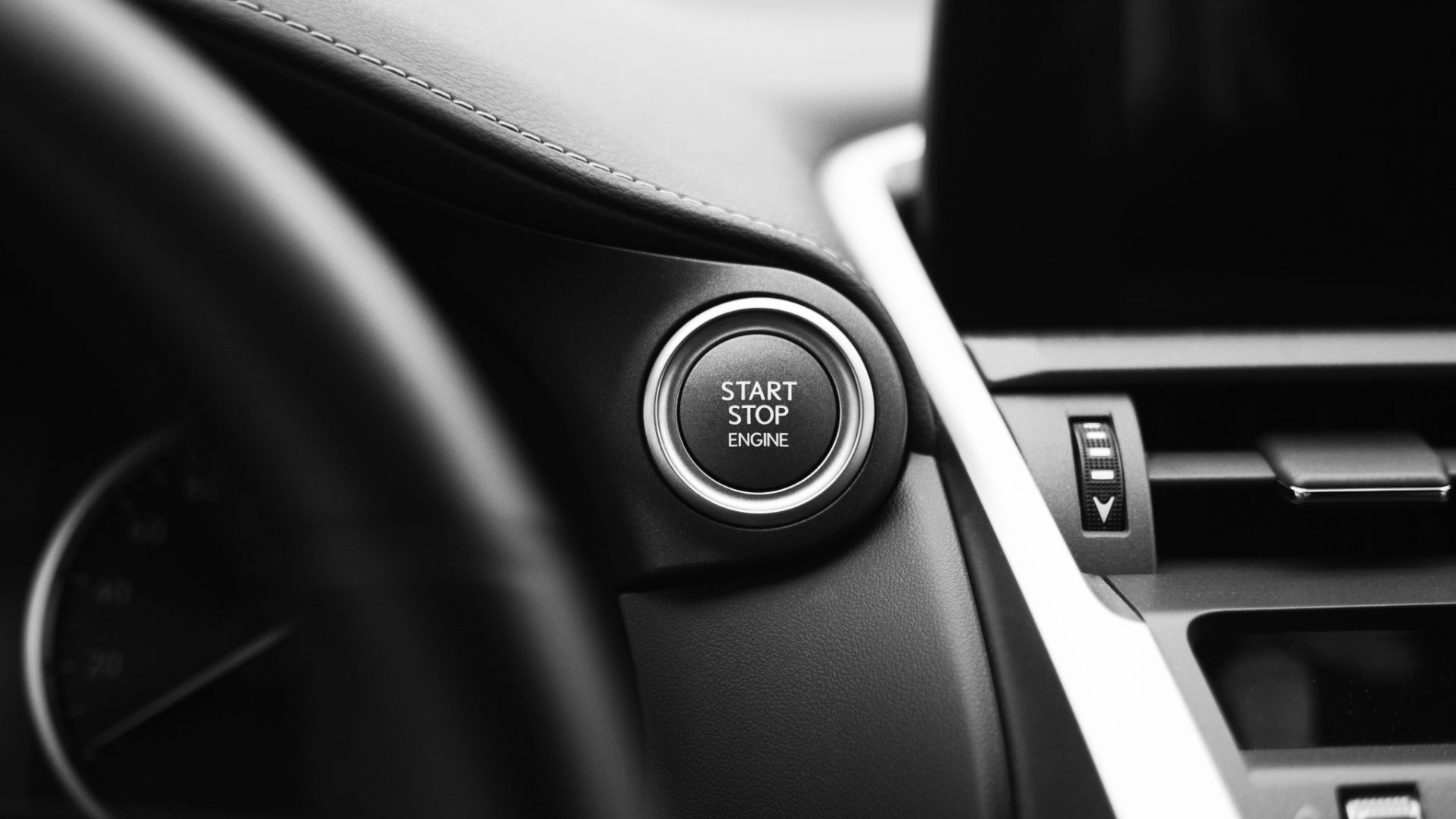 a black and white photo of a car dashboard.