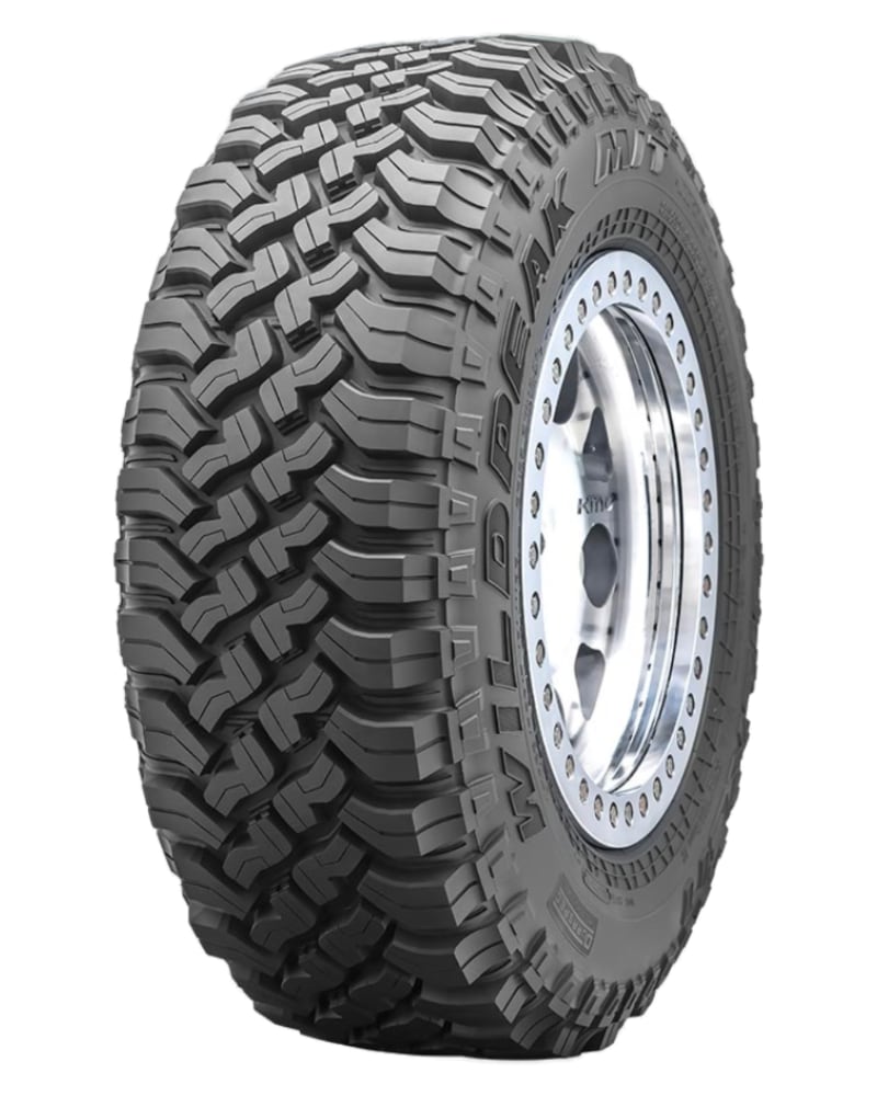 an all terrain tire on a white background.