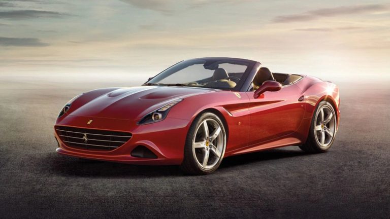 a red sports car parked in a parking lot.