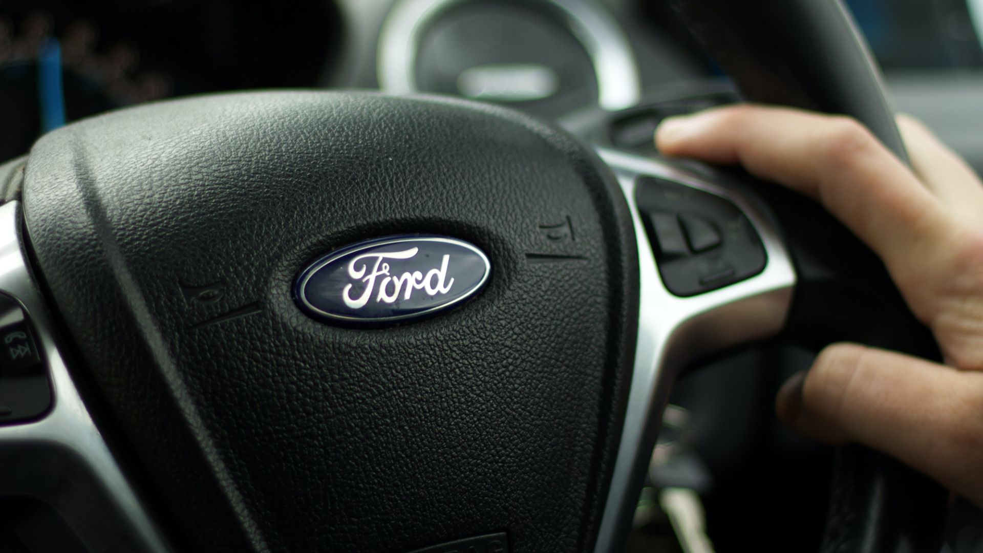 a close up of a person driving a car.