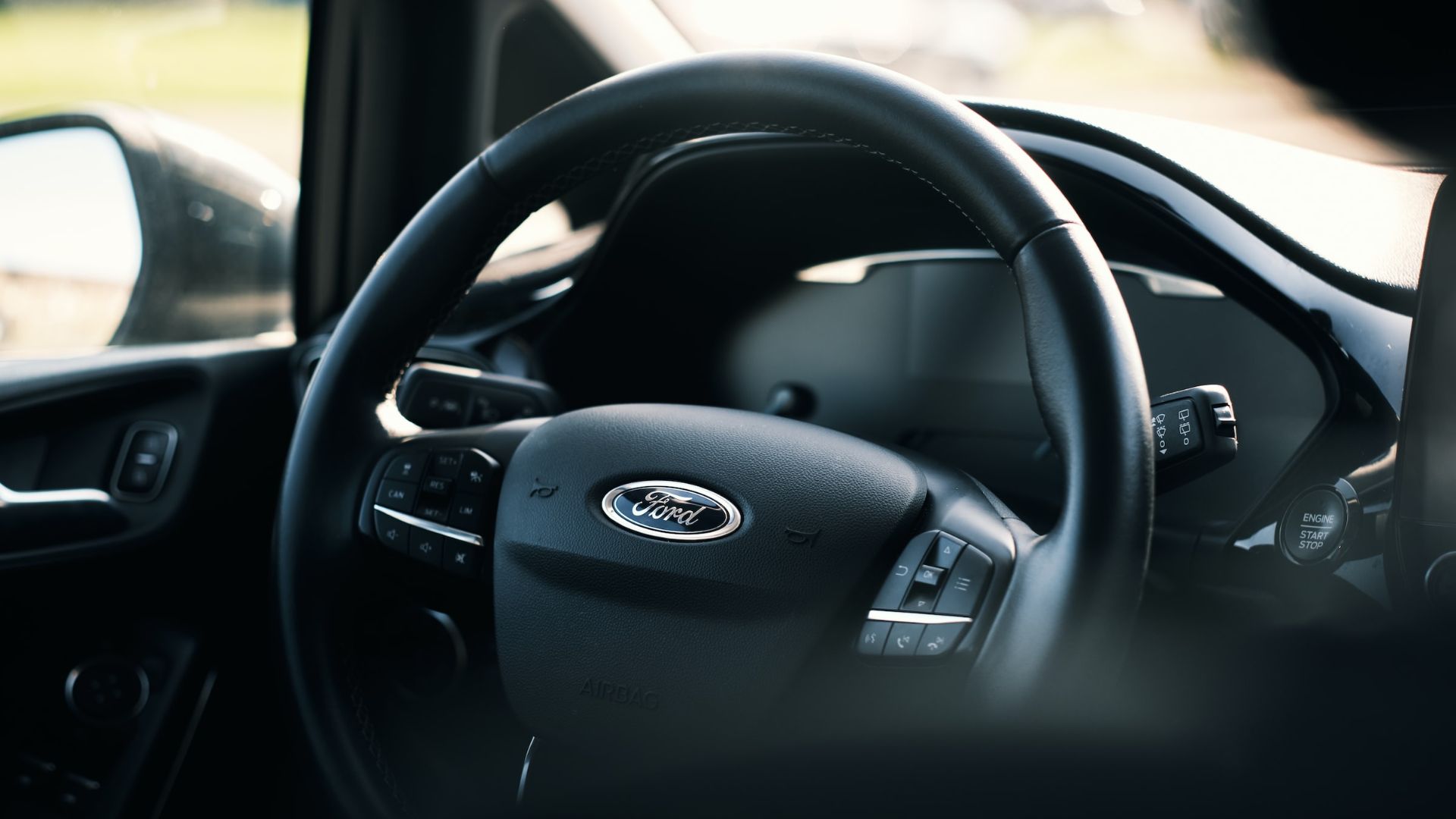 a close up of a steering wheel of a car.