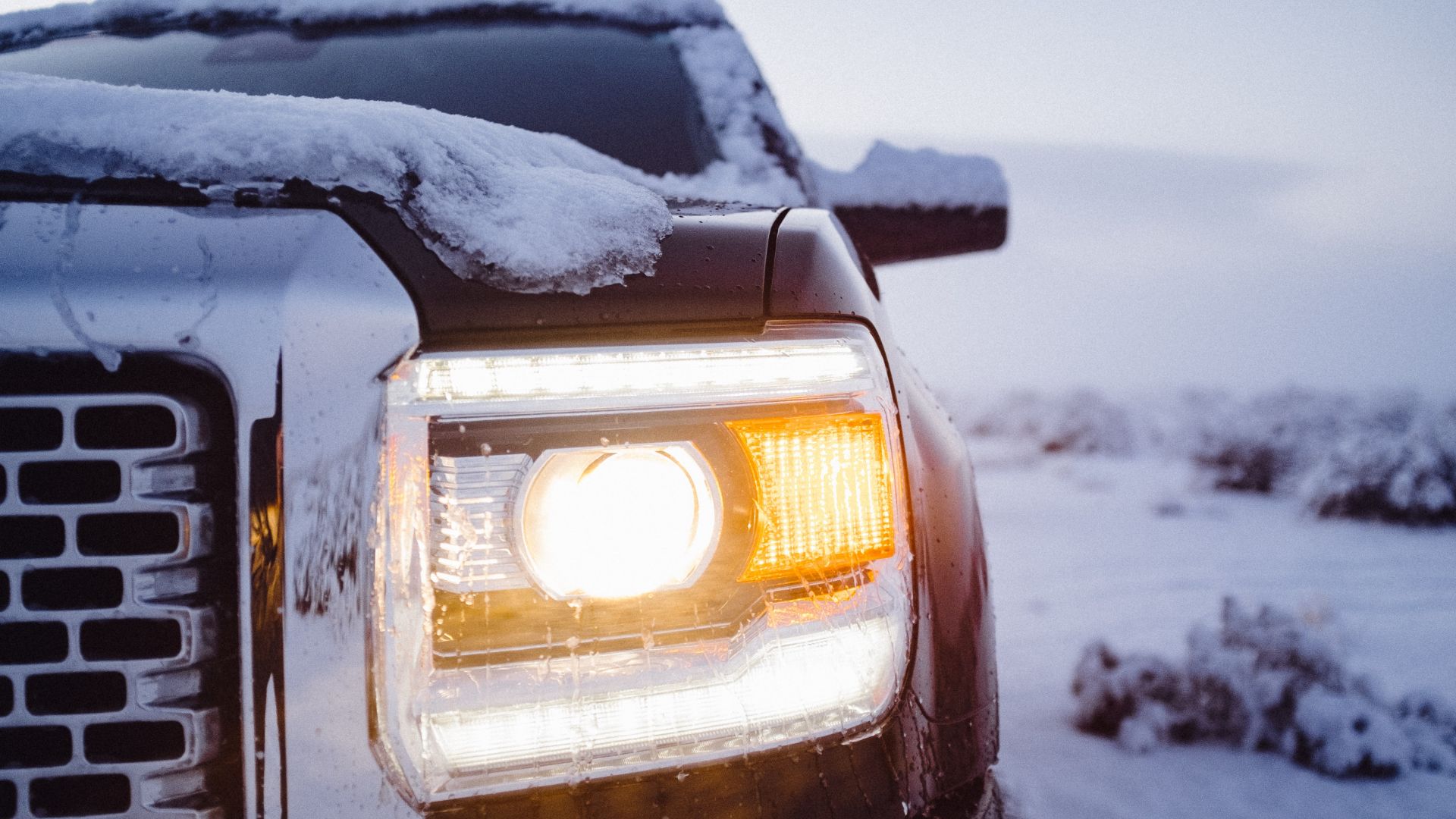 a close up of a truck in the snow.