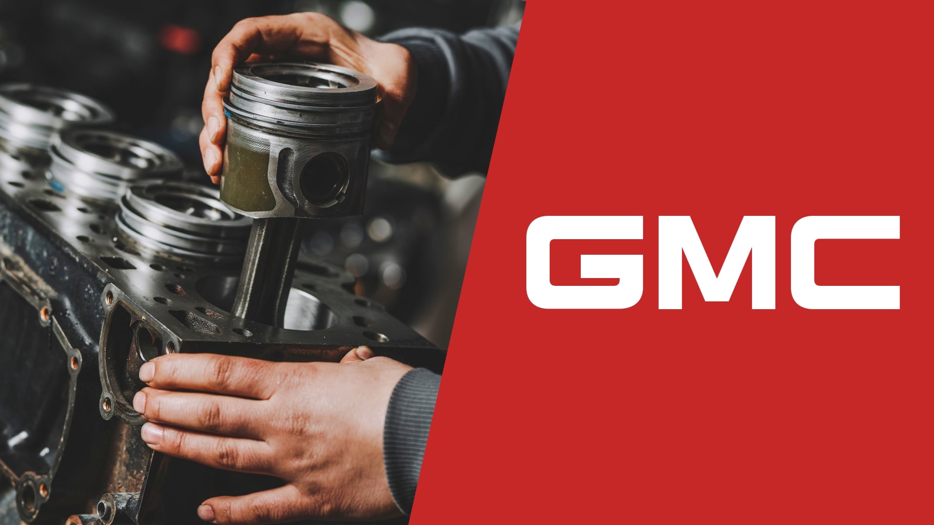 The gmc logo with a man working on a car engine.