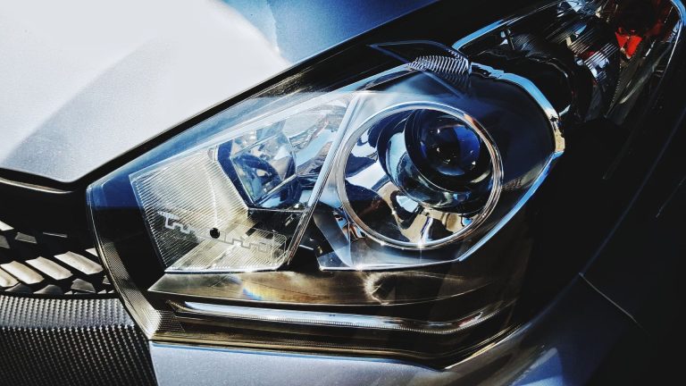 a close up of a headlight on a car.