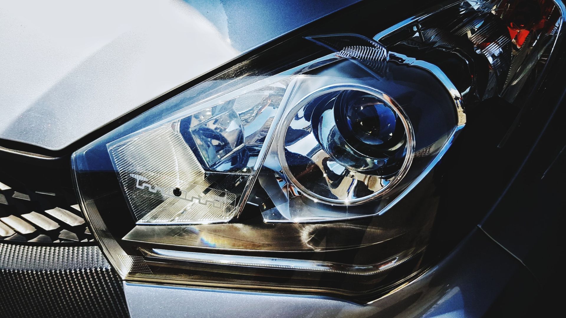 a close up of a headlight on a car.