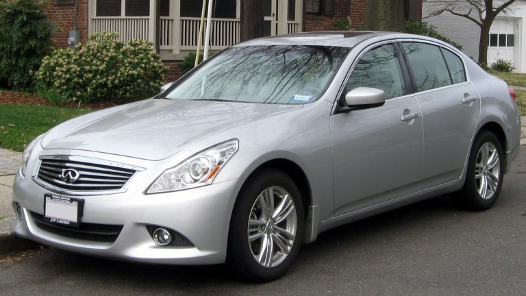 a silver car parked on the side of the road.