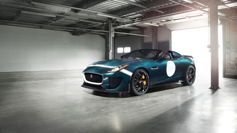 a blue sports car parked in a garage.