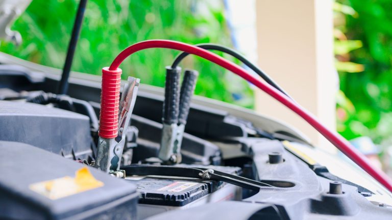 a close up of a car's battery and wires.