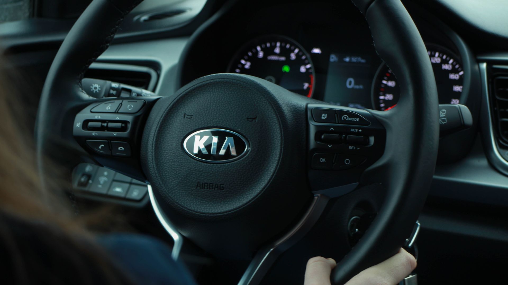 a close up of a person driving a car.